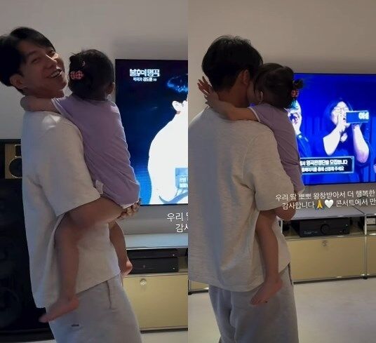 李昇基看着两岁的女儿庆祝胜利，脸上洋溢着幸福的笑容……“被亲了一脸之后更开心了”