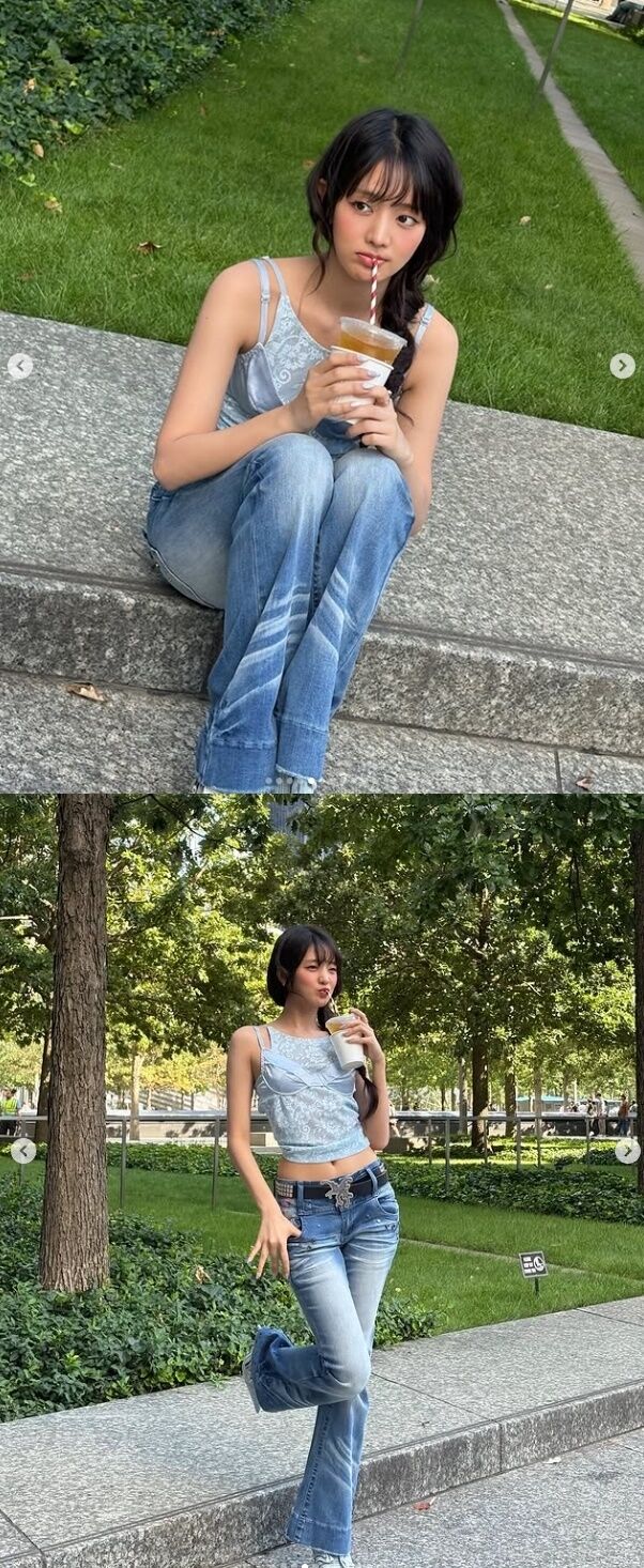민니는 하늘색 레이스 소재의 크롭 탑에 빈티지한 워싱이 돋보이는 로우라이즈 부츠컷 데님 팬츠를 착용한 컷은 뉴욕 도심 속 공원을 배경으로 청량하고 러블리한 분위기를 연출했다./민니 소셜미디어